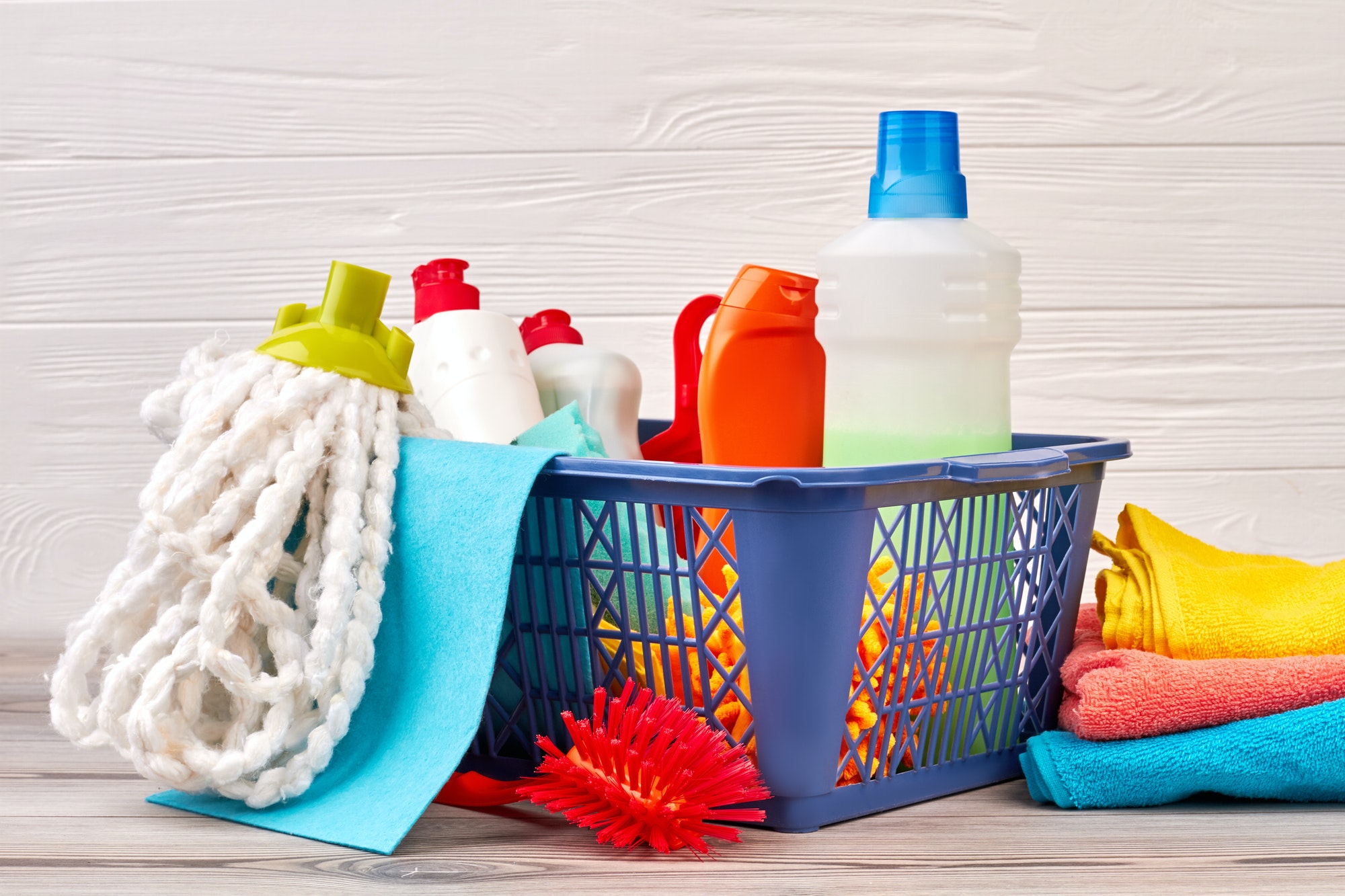 Chemical cleaning supplies in basket.